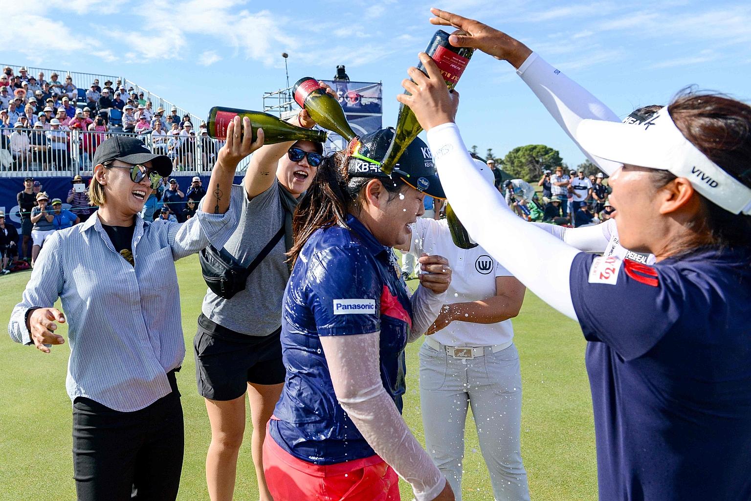 South Korea's Park In-bee getting a champagne shower after the Women's Australian Open win, her first title in two years. PHOTO: AGENCE FRANCE-PRESSE