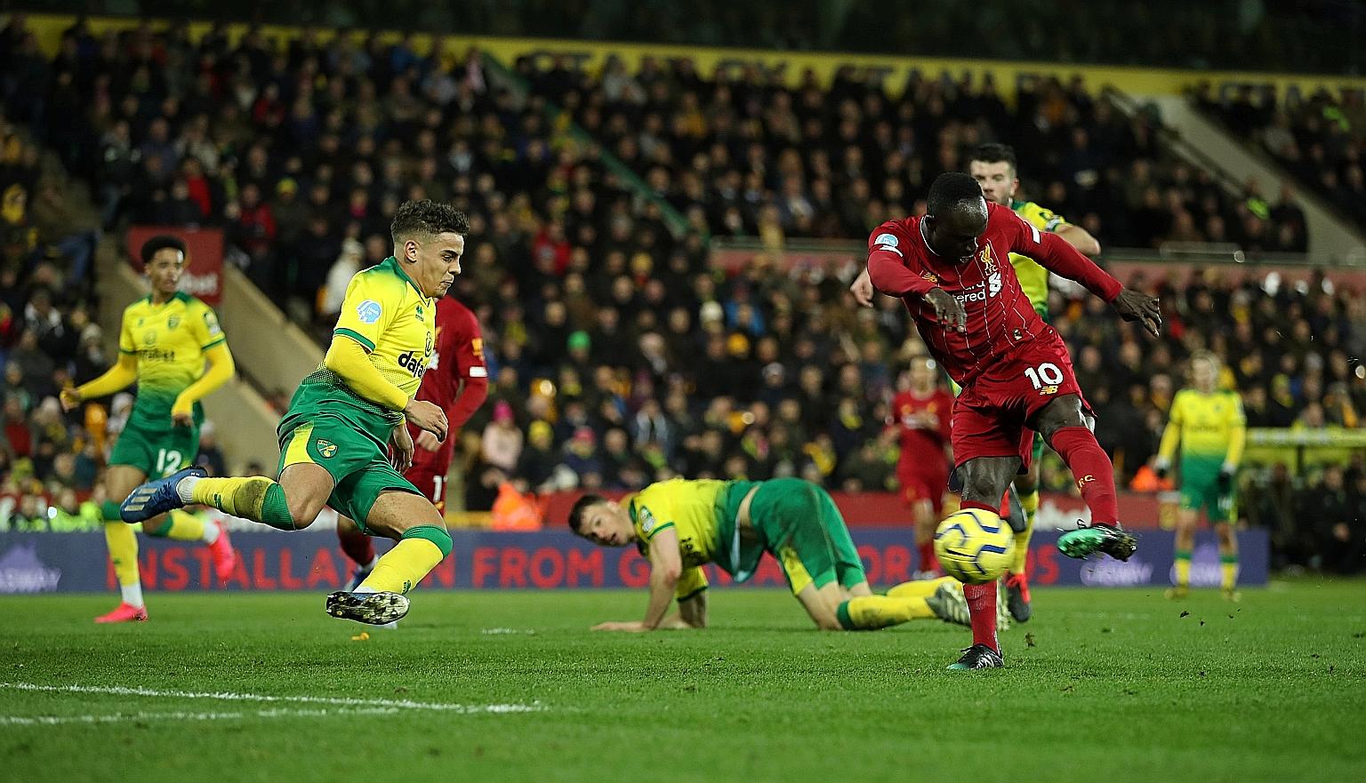 Liverpool substitute Sadio Mane rifling home to break the deadlock with what proved to be the match-winner against Norwich at Carrow Road in the Premier League on Saturday. It was his 100th goal in English football. PHOTO: REUTERS