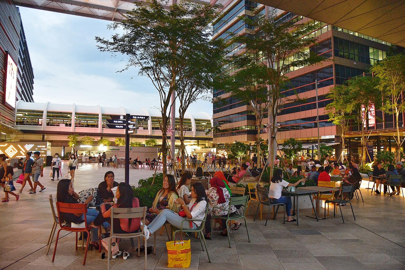 The scene at Paya Lebar Quarter Mall yesterday. Though some places saw far smaller crowds over the weekend, others saw things returning to normal with many heading out to cafes and bars and malls.