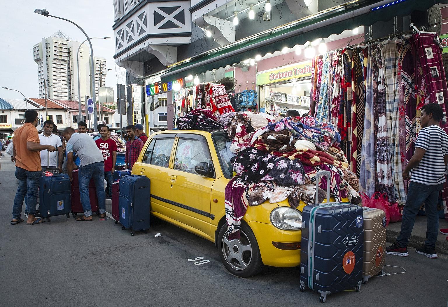 This car in Roberts Lane is filled to the brim with blankets, imported from China and Korea, for sale. It is one of four belonging to Shabnam Trading, which sells blankets and household appliances, mainly to migrant workers, from the cars. Shop owner