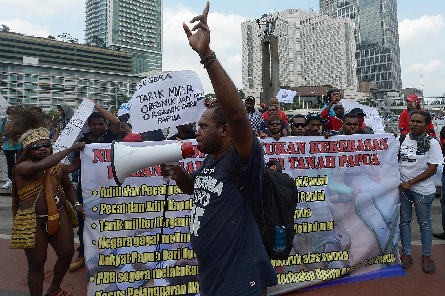 A Papuan activist delivering a speech during a protest in Jakarta in December 2014 against the fatal shooting of four high school students in Paniai, a central area of Papua province.