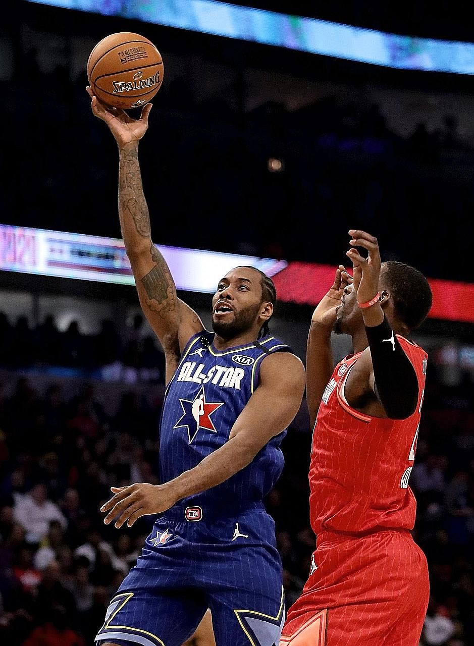 Team LeBron's Kawhi Leonard shooting over Bam Adebayo of Team Giannis during the NBA All-Star Game. Leonard was named the All-Star Most Valuable Player for his game-high 30 points. PHOTO: AGENCE FRANCE-PRESSE