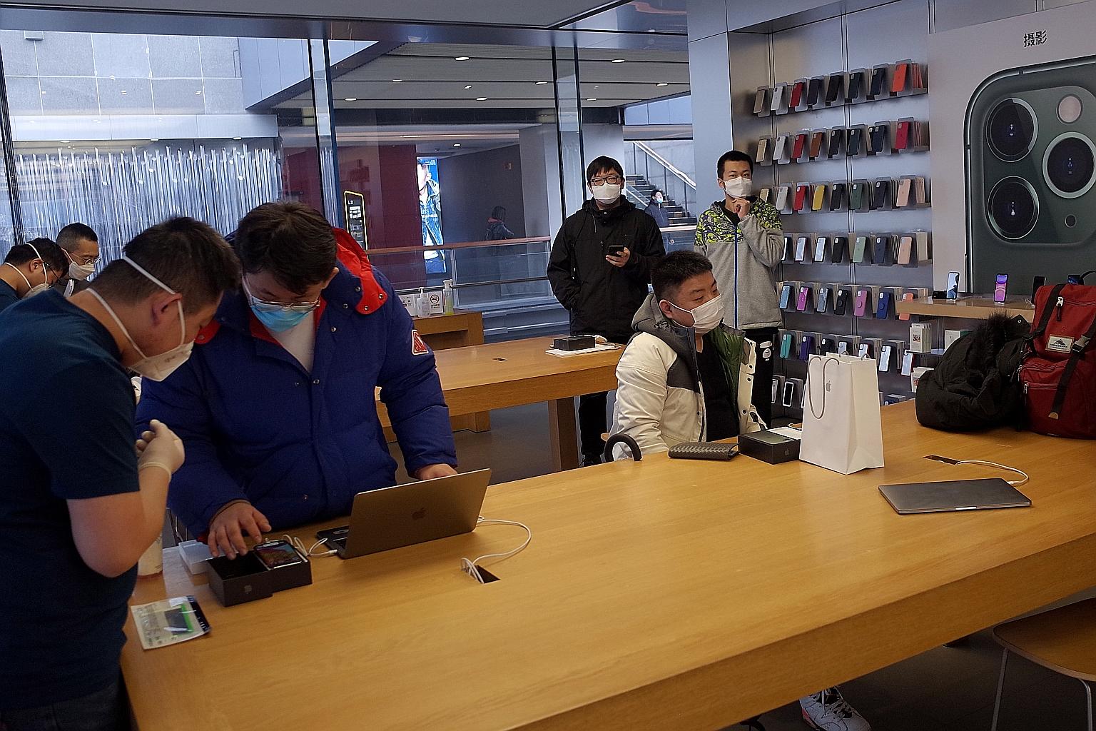 An Apple Store in Beijing. The company said store restrictions due to coronavirus precautions have affected its sales in China, with most retail stores either closed or operating at reduced hours and with very low customer traffic.