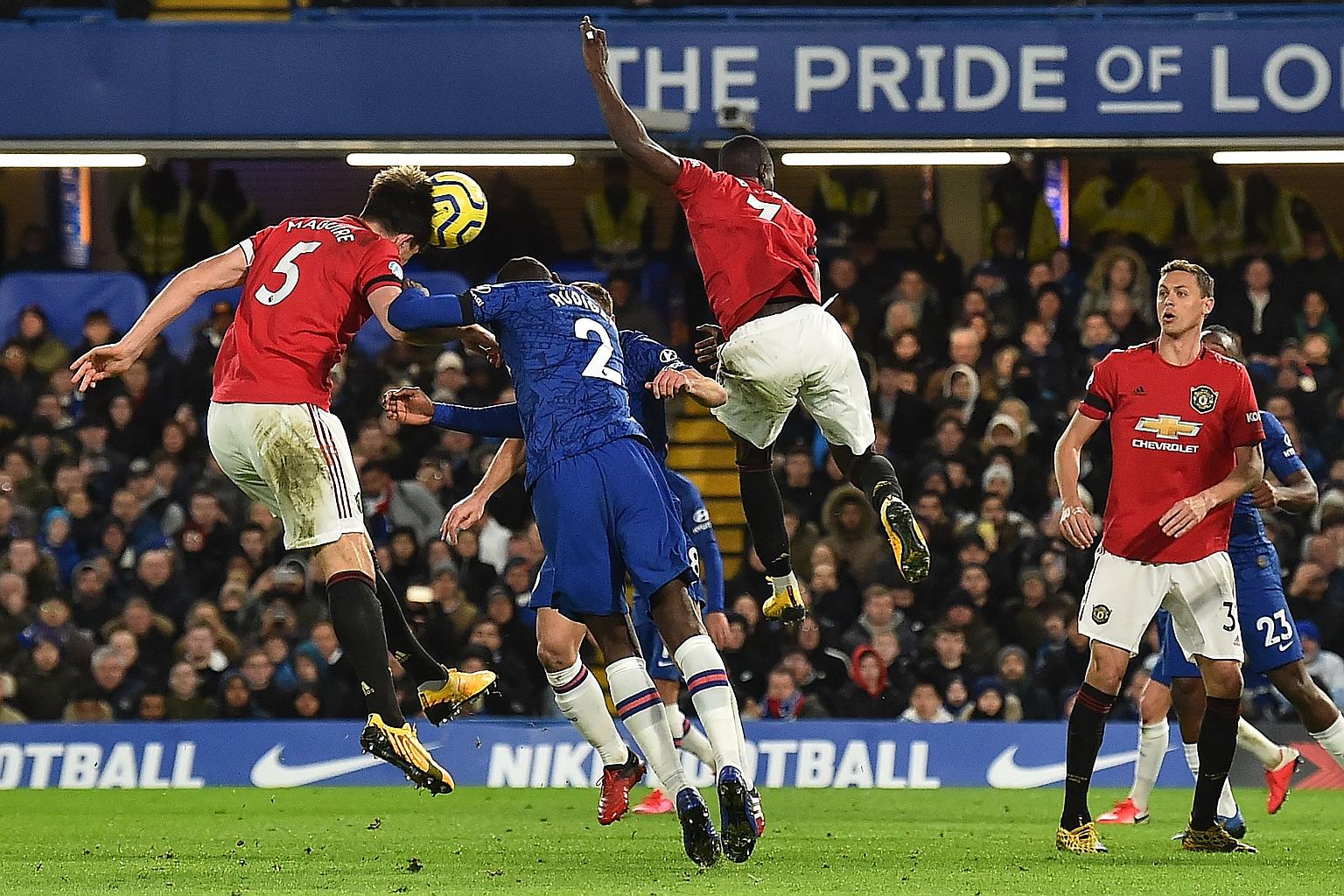 Harry Maguire (left) heading home Manchester United's second goal from a corner during their 2-0 win over Chelsea.