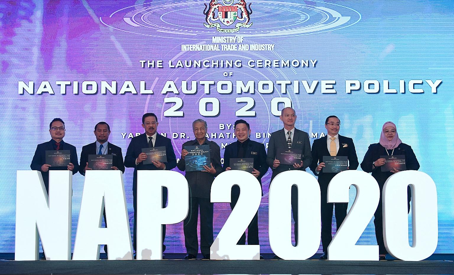 Malaysian Prime Minister Mahathir Mohamad at the launch of the National Automotive Policy 2020 yesterday. Among those present were International Trade and Industry Minister Darell Leiking (fourth from right) and Deputy Minister Ong Kian Ming (third f