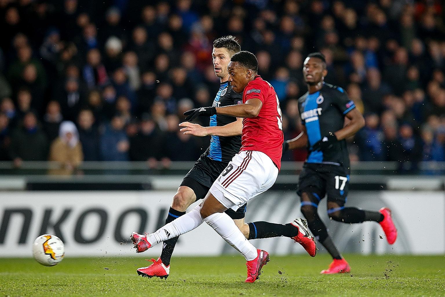 Manchester United forward Anthony Martial equalising in the 1-1 Europa League last-32, first-leg draw against Club Brugge at the Jan Breydel Stadium on Thursday. He needs three more goals to tie his season-best of 17. PHOTO: AGENCE FRANCE-PRESSE