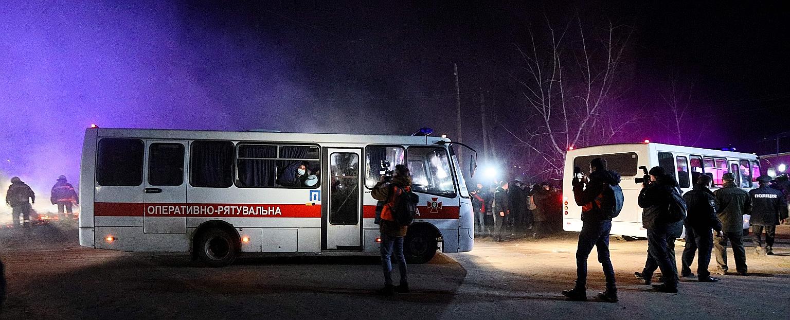 Buses carrying evacuees from coronavirus-hit China making their way to a medical facility in the settlement of Novi Sanzhary in Ukraine on Thursday. Fears over the possible spread of the virus have led to clashes between protesters and the police, an