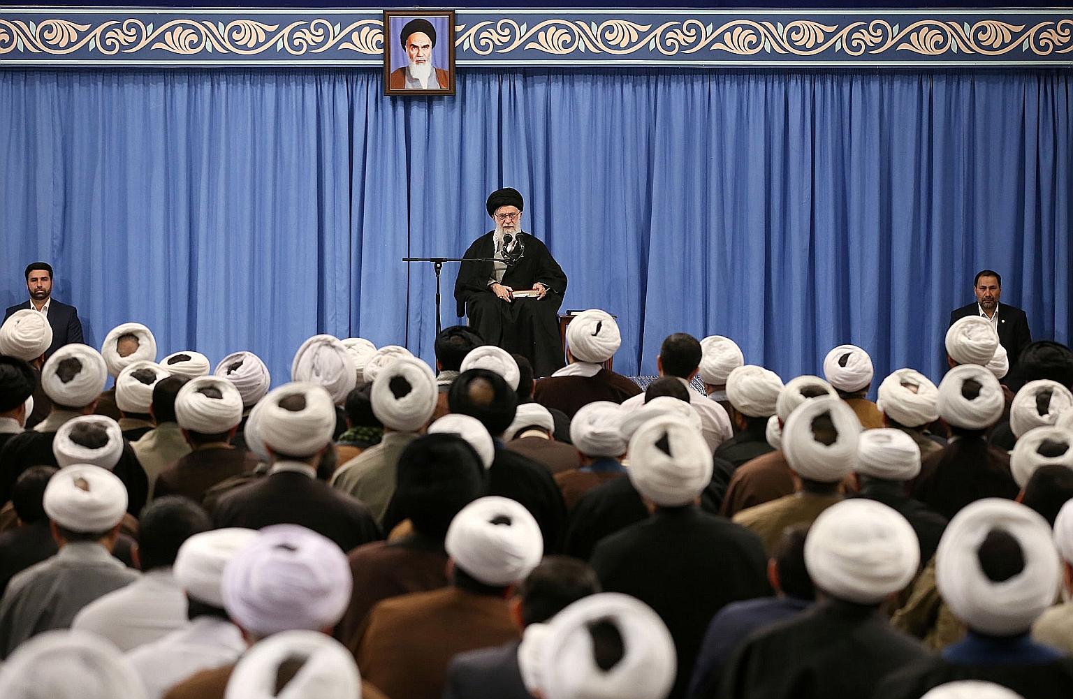 Iranian Supreme Leader Ayatollah Ali Khamenei at a meeting in Teheran yesterday. Given the vacuum among moderate candidates, conservative factions loyal to Mr Khamenei and generally opposed to engaging with the West were widely expected to prevail in