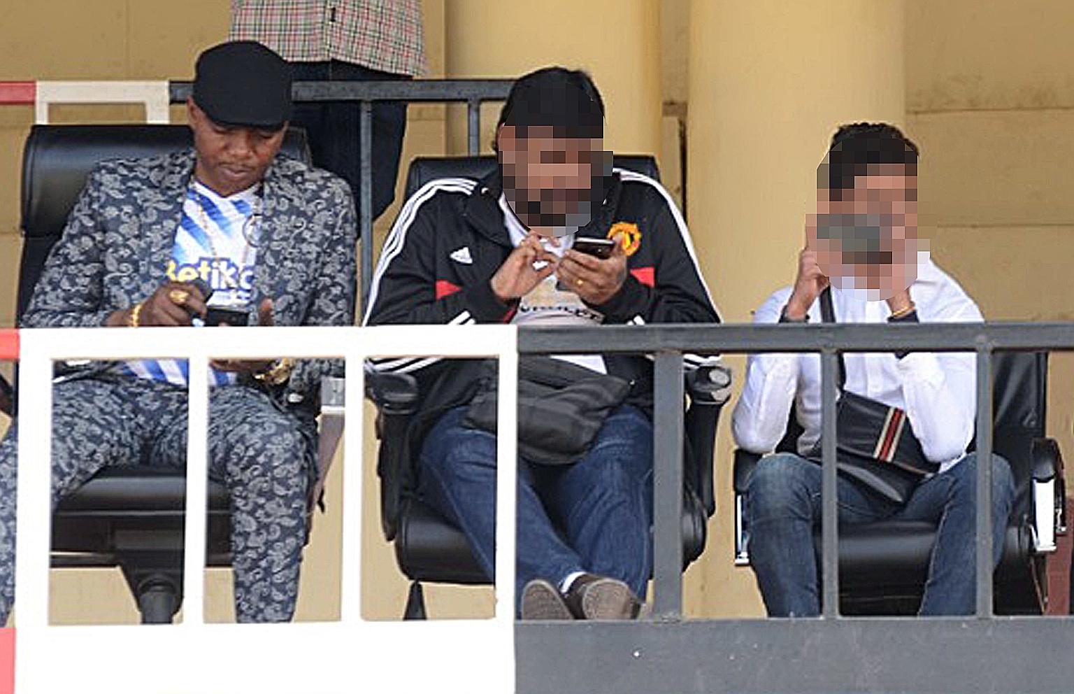 Sofapaka Football Club's chairman Elly Kalekwa (far left), with two Singaporeans who claimed to represent a Hong Kong firm, watching the club's maiden game on Aug 30 last year for the 2019/2020 season. Although large sums were promised as part of a s