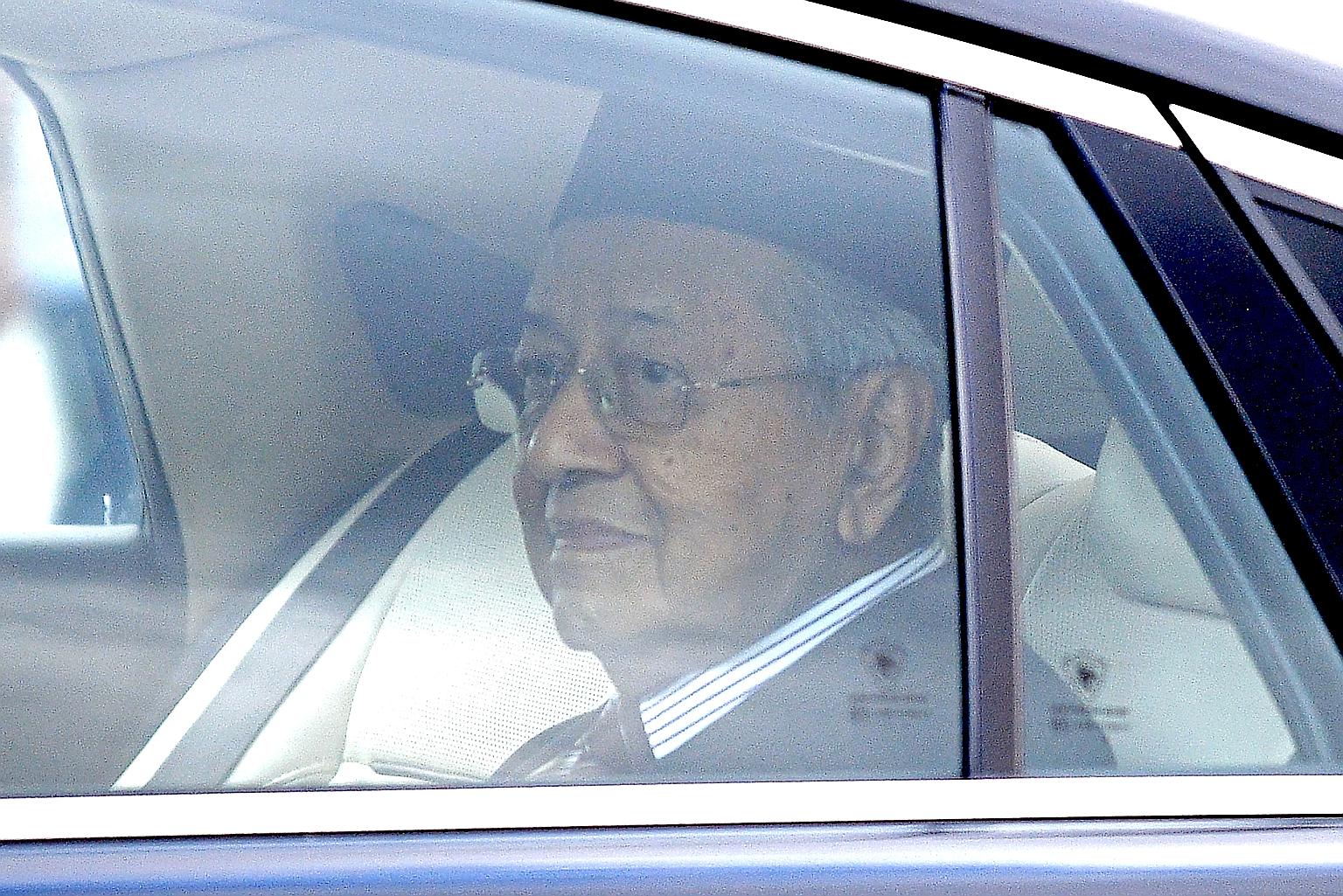 Tun Dr Mahathir Mohamad leaving the national palace in Kuala Lumpur yesterday. The King accepted his resignation as premier. PHOTO: AGENCE FRANCE-PRESSE