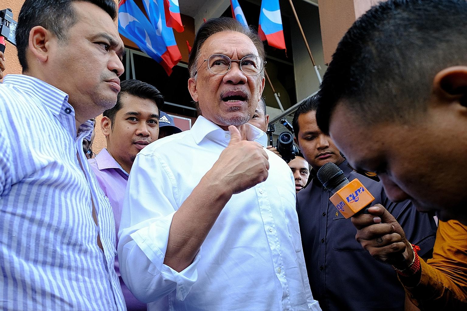 Parti Keadilan Rakyat president Anwar Ibrahim speaking to the media yesterday as he left the party headquarters in Petaling Jaya, Selangor. He said he had pleaded with Dr Mahathir Mohamad not to resign as premier.