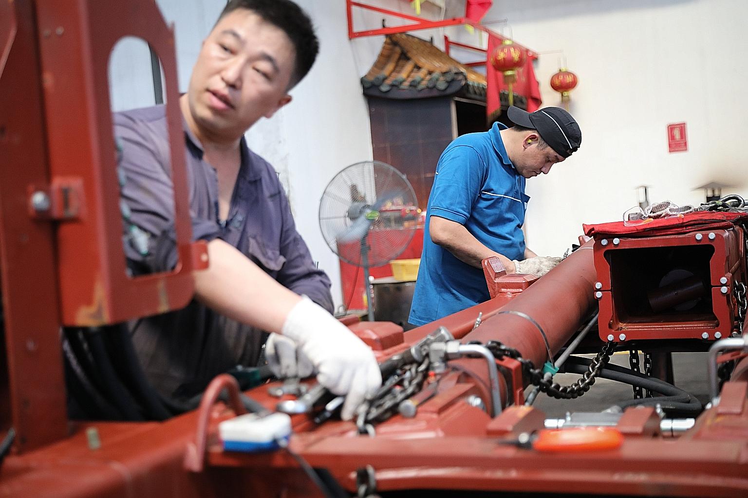 Staff at work at Wong Fong Engineering Works, which could benefit from a move to let Chinese work pass holders in manufacturing and services switch jobs within their sectors.