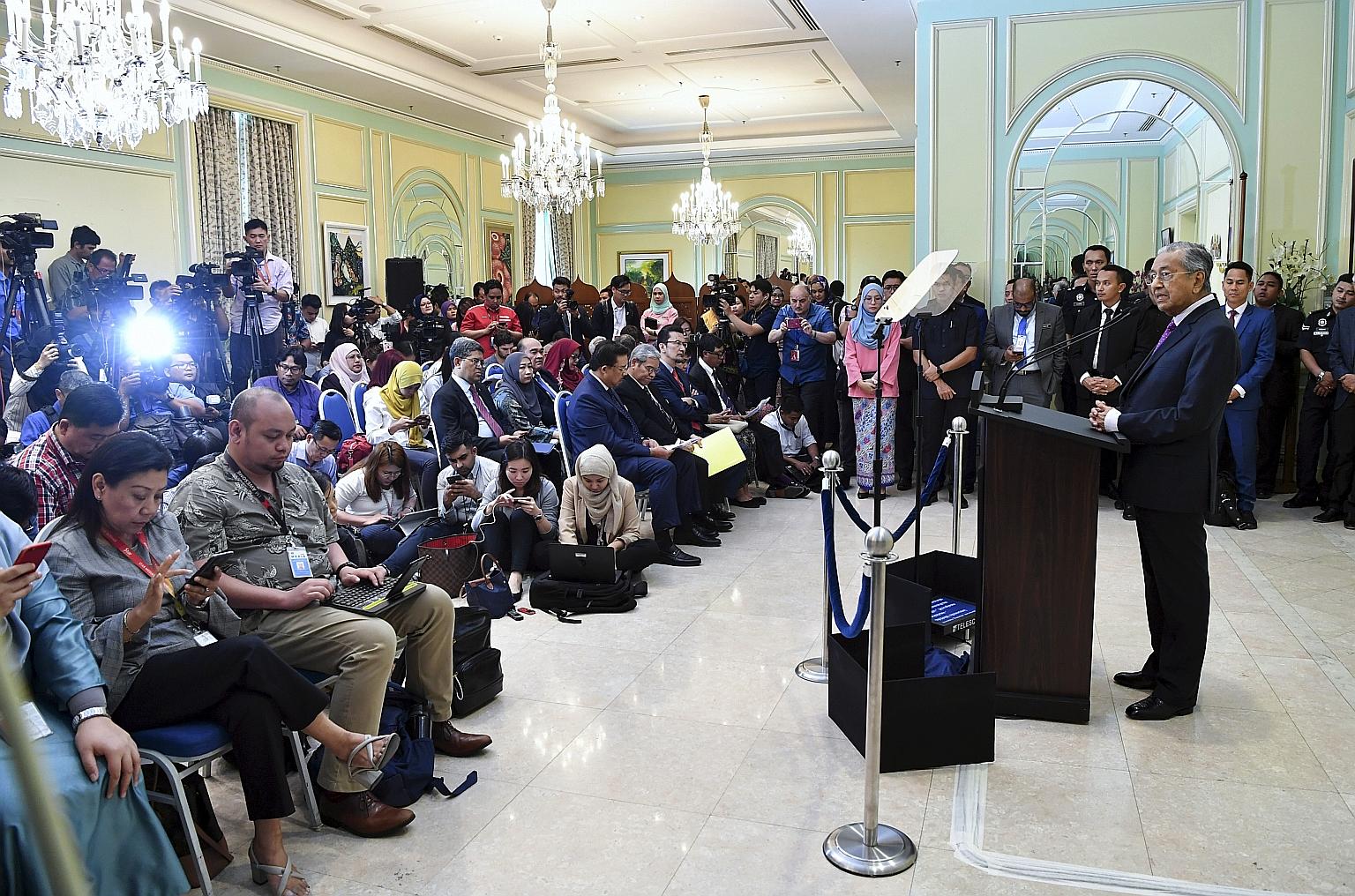 Interim Prime Minister Mahathir Mohamad, addressing a press conference in Putrajaya yesterday, said that if the Malaysian Parliament fails to find a person with majority support, "we would have to go for a snap election". PHOTO: BERNAMA