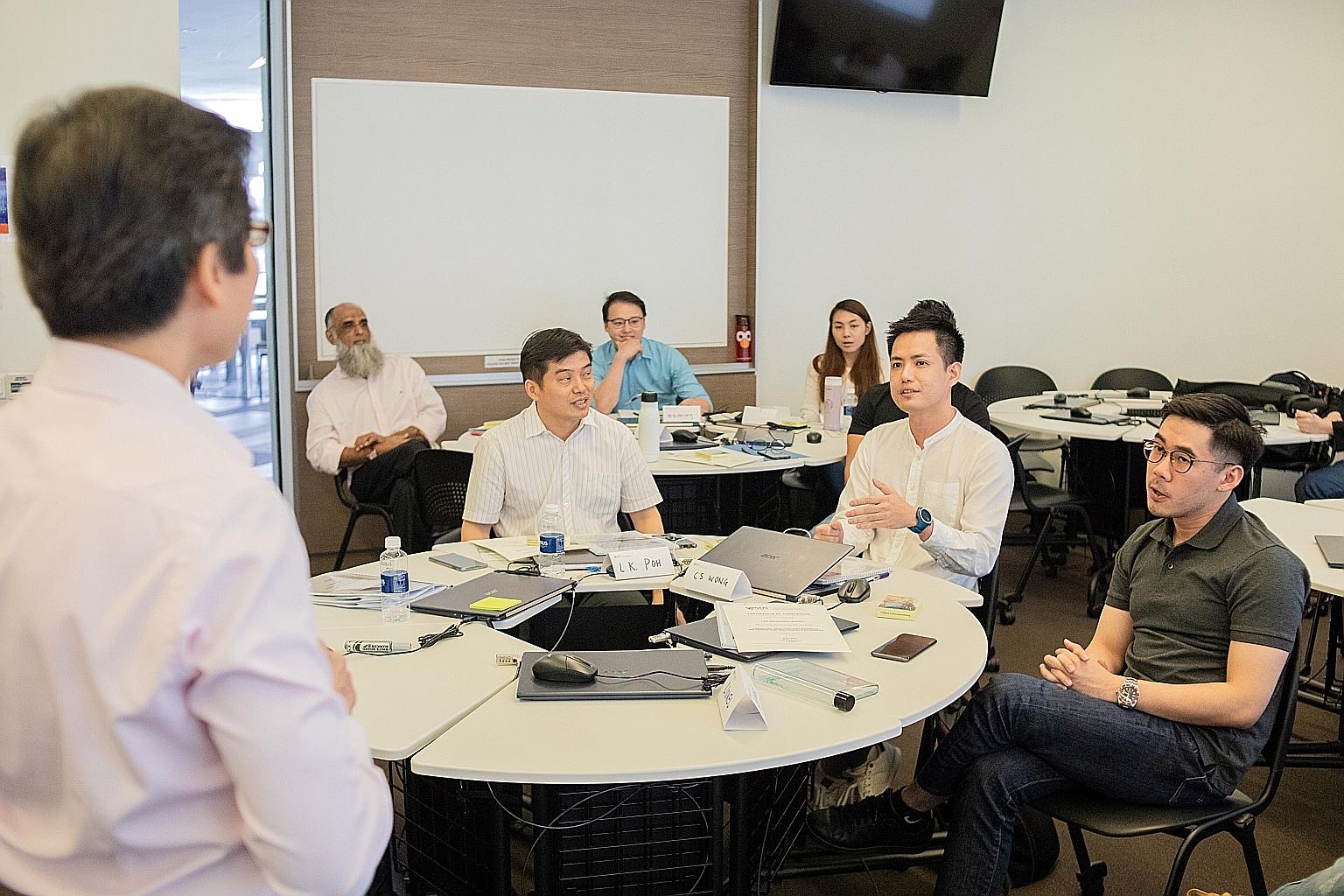 Adult learners at the National University of Singapore's School of Continuing and Lifelong Education last year. The university's new Advance@NUS scheme starts this year.