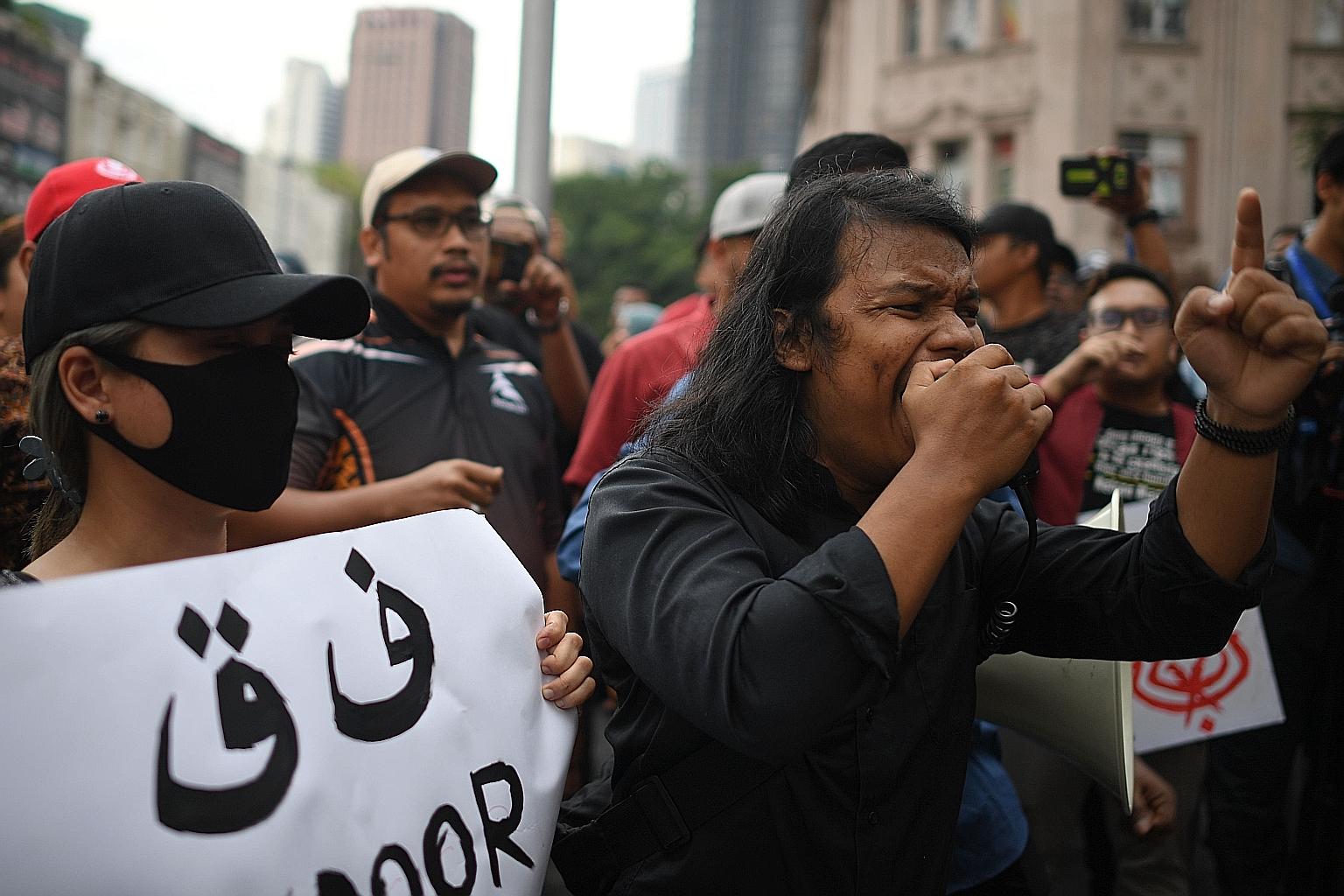 Protesters at a rally in front of Sogo mall in central Kuala Lumpur yesterday. The rally was organised by a group that wants Parliament to be dissolved and fresh polls held.