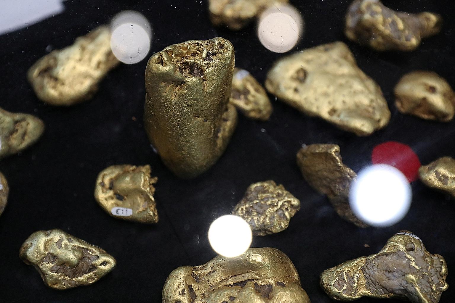Gold has a long-standing reputation as a go-to asset in times of stress. Its big slump last Friday was put down to investors' forced selling to cover losses elsewhere, and analysts do not see that as a sign of loss in faith in its role. PHOTO: REUTER