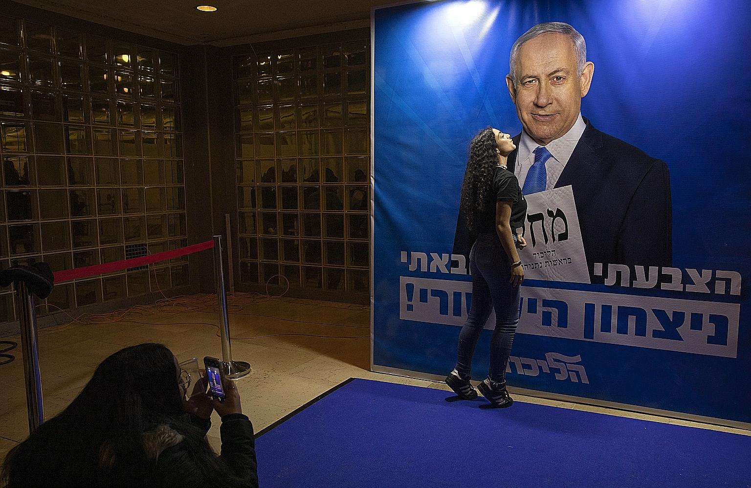 A portrait of Israeli Prime Minister Benjamin Netanyahu in Jerusalem in January. Mr Netanyahu and former military chief Benny Gantz yesterday duelled in their third election match-up in less than a year.