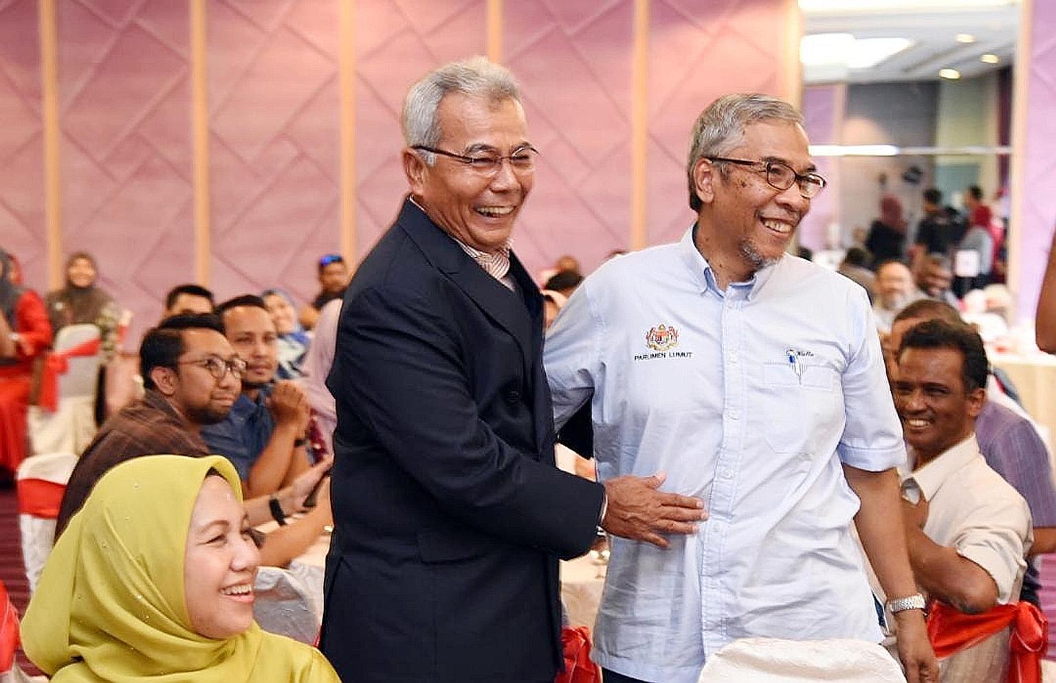 Former entrepreneur development minister Redzuan Yusof (left) and his former deputy minister Hatta Ramli at a ministry function last Thursday that was also attended by a confirmed coronavirus patient.
