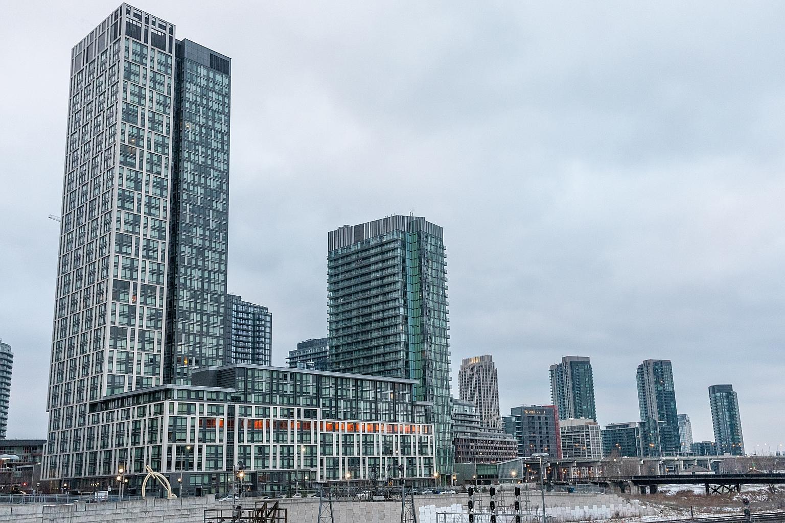 Residential buildings in the CityPlace development in Toronto, Canada. The global real estate market is hurting from the absence of Chinese buyers, as many of them are quarantined or facing travel restrictions.