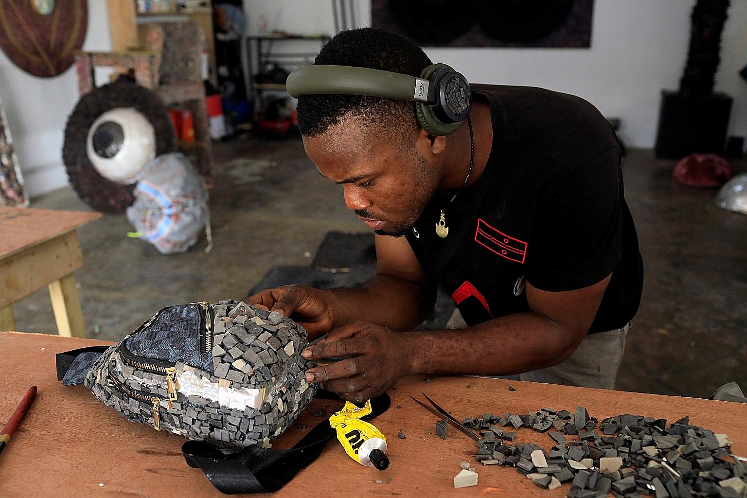 Visual artist Adeyemi Emmanuel recycles waste materials and incorporates them into redesigned goods.