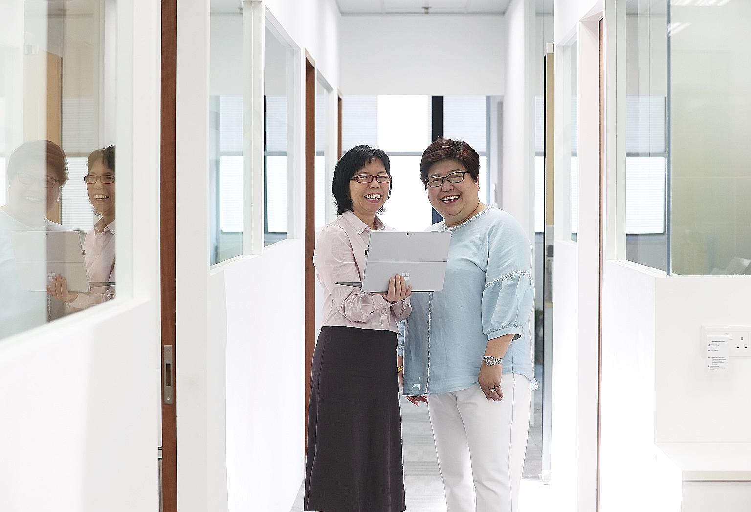Ms Janna Chui with her boss Emerlin Toh (far right). After Ms Chui underwent the professional conversion programme for Microsoft SQL server administrator or developer, Ms Toh, managing director of Reach Technologies, felt she had held her own and pro