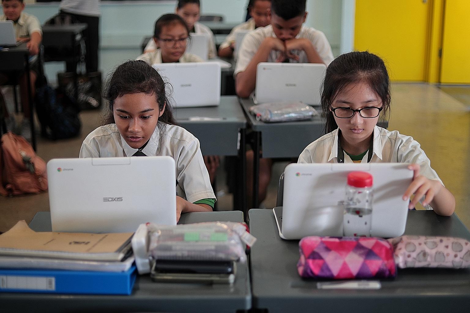 Orchid Park Secondary School students using Chromebooks as part of a mathematics lesson. During lessons, teachers are able to monitor students' progress in real time. They can see which questions students are struggling with and quickly address any m