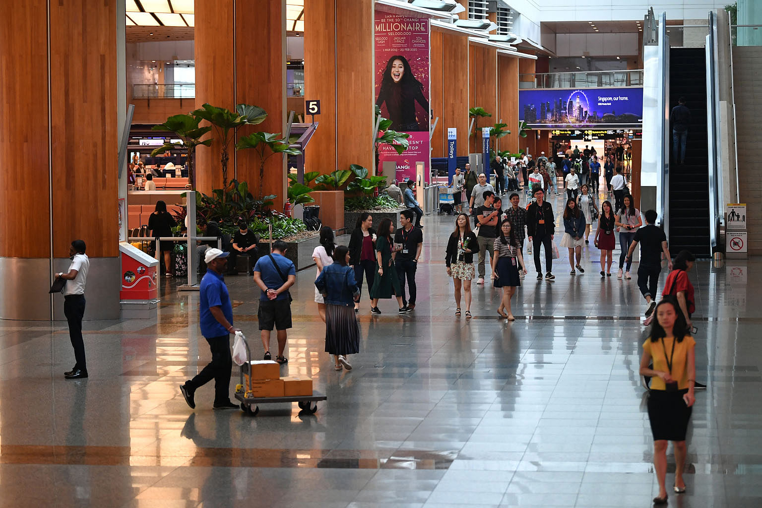 Visitors at Changi Airport's Terminal 2 last month. One reason the Covid-19 outbreak is projected to have a bigger impact than Sars on airlines is that the Chinese travel market is about four times the size it was back in 2003, so Asia-Pacific airlin