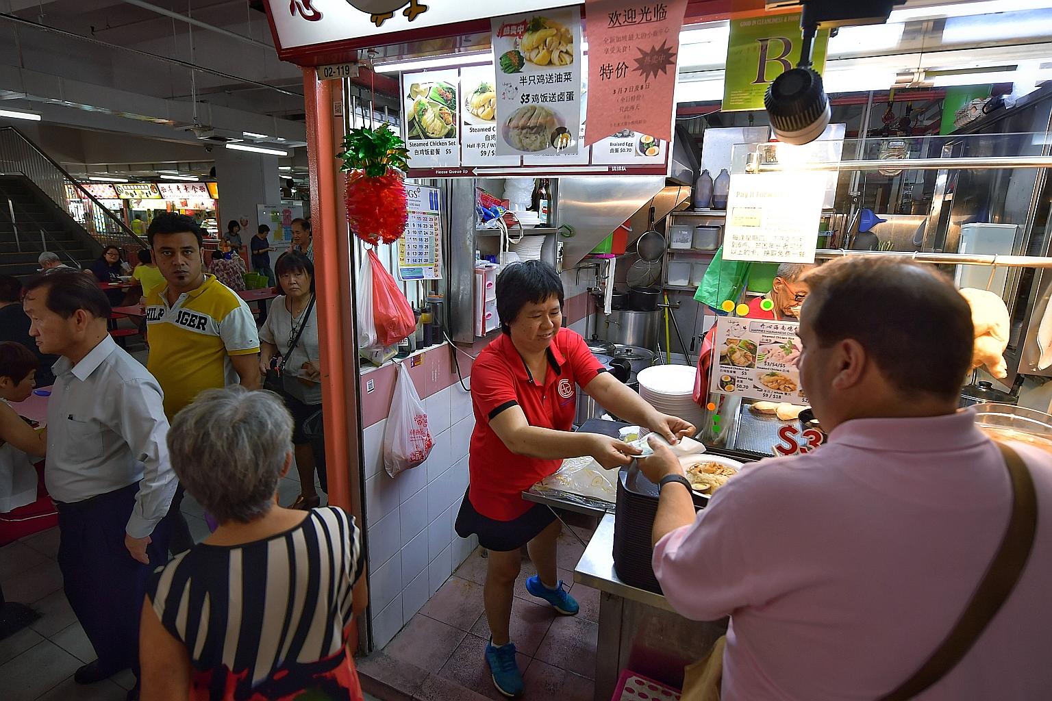 Madam Connie Chan, who runs a chicken rice stall at Chinatown Complex Food Centre, says businesses in the area have been badly affected as tourist numbers have fallen following travel restrictions, while locals have kept away out of fear of crowded a