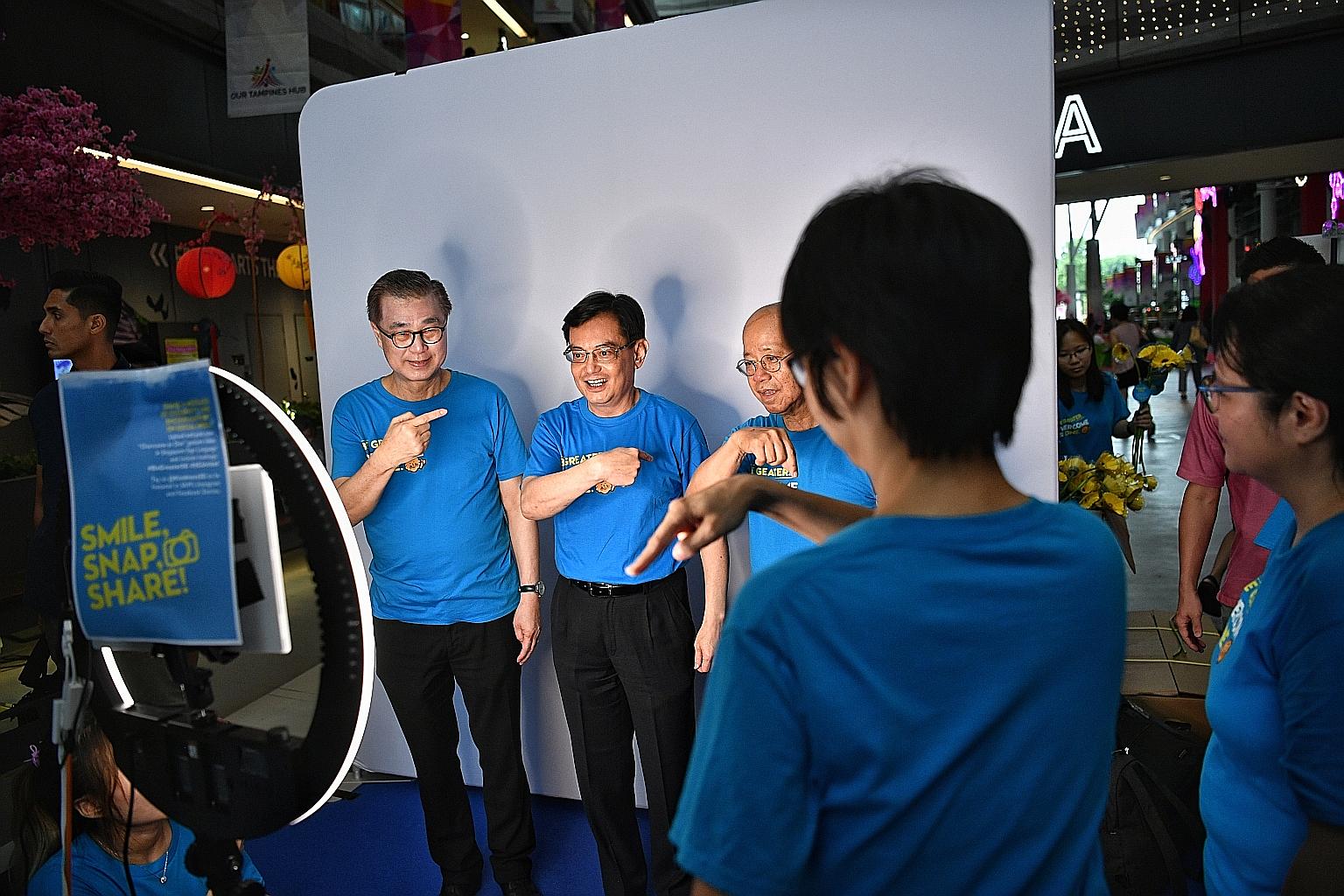 Deputy Prime Minister Heng Swee Keat at the launch of Overcome As One movement yesterday. He is flanked by Singapore Kindness Movement general secretary William Wan (right) and council chairman Koh Poh Tiong. ST PHOTO: ARIFFIN JAMAR
