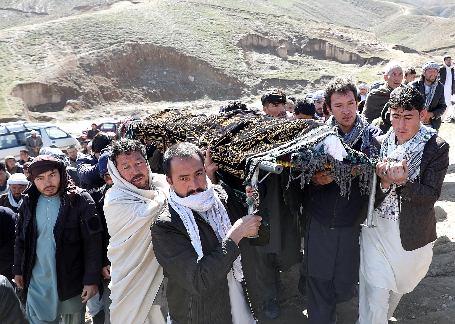Relatives carrying the body of a victim during funerals for the victims of Saturday's attack in Kabul. The Taleban has struck scores of targets in Afghanistan.
