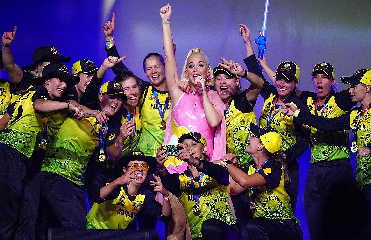 American singer Katy Perry performing on stage with the Australian cricket team after the Women's T20 World Cup final on International Women's Day. Tennis legend Billie Jean King was among the MCG crowd, which fell short of the 90,185 who turned up for th