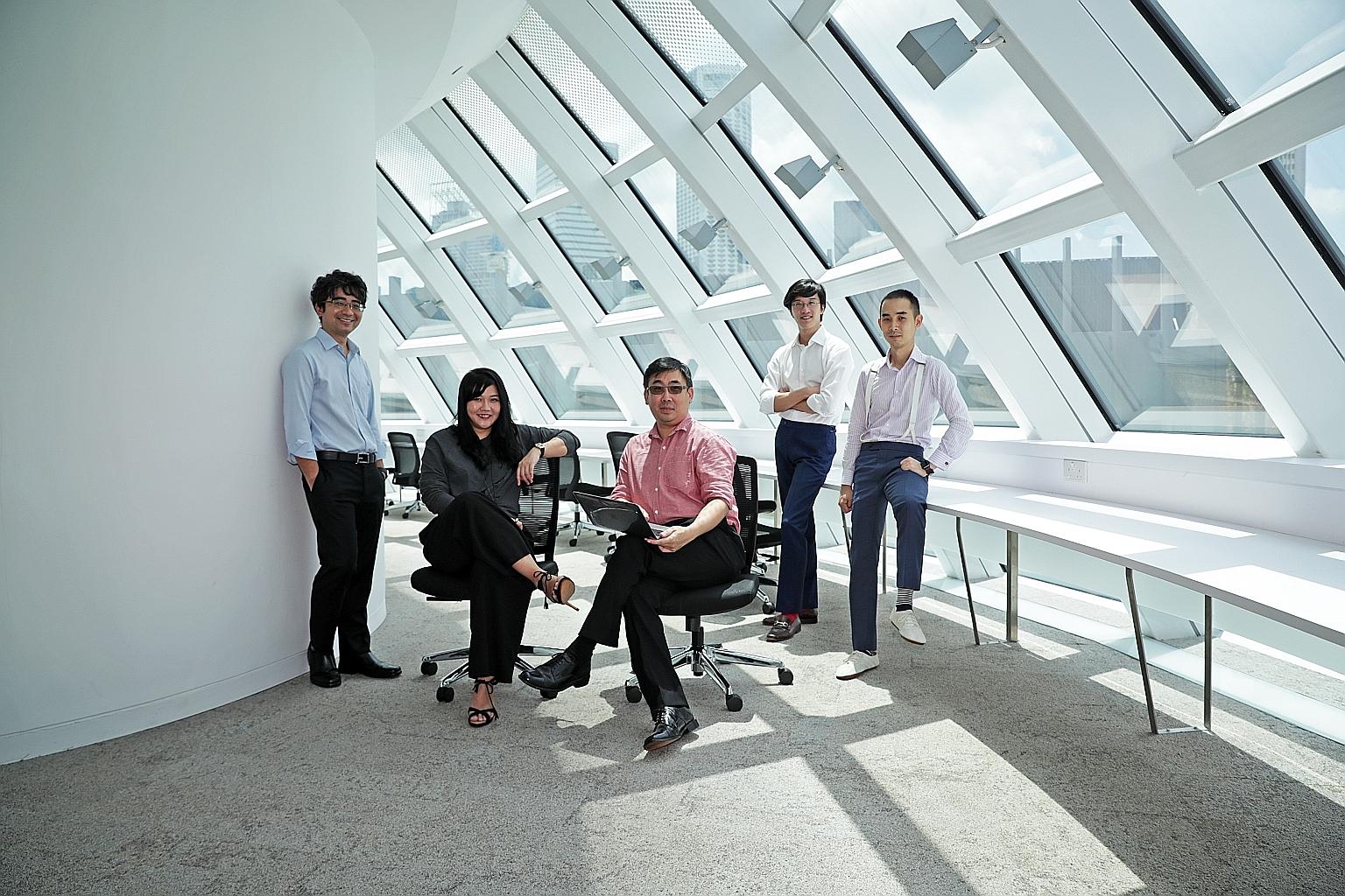 Working on the five-year research programme in computational law are (from left) Professor Goh Yihan, dean of Singapore Management University School of Law; Ms Alexis Chun and Mr Wong Meng Weng, co-founders of local legal tech start-up Legalese; and