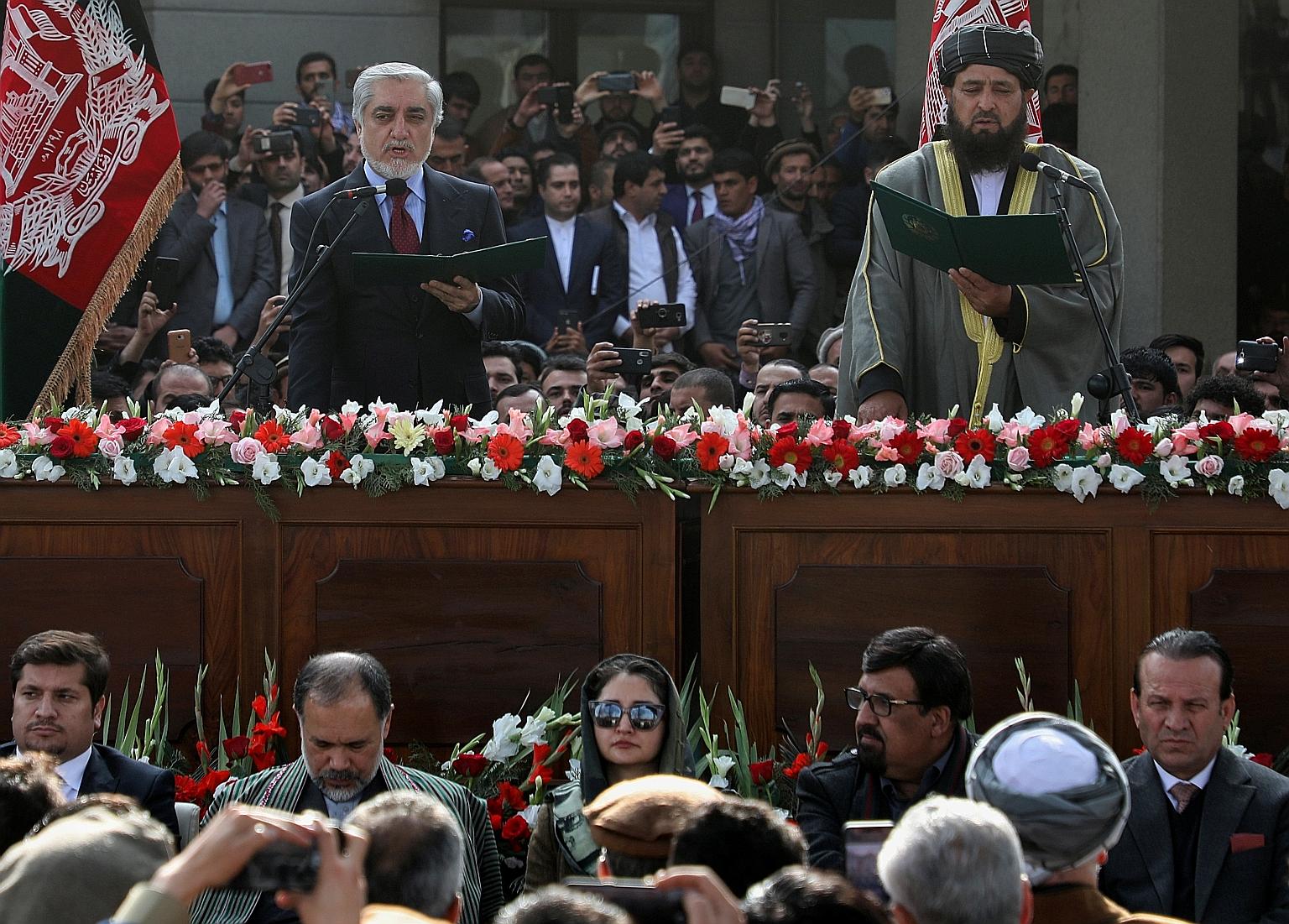 Mr Abdullah Abdullah swore himself in as Afghan premier on Monday, in a move denounced by the US.