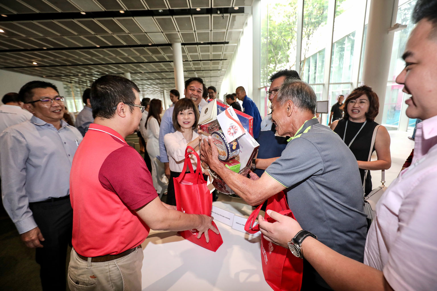 Senior Minister of State for the Environment and Water Resources Amy Khor presenting care packages to environmental service workers at Republic Polytechnic yesterday.