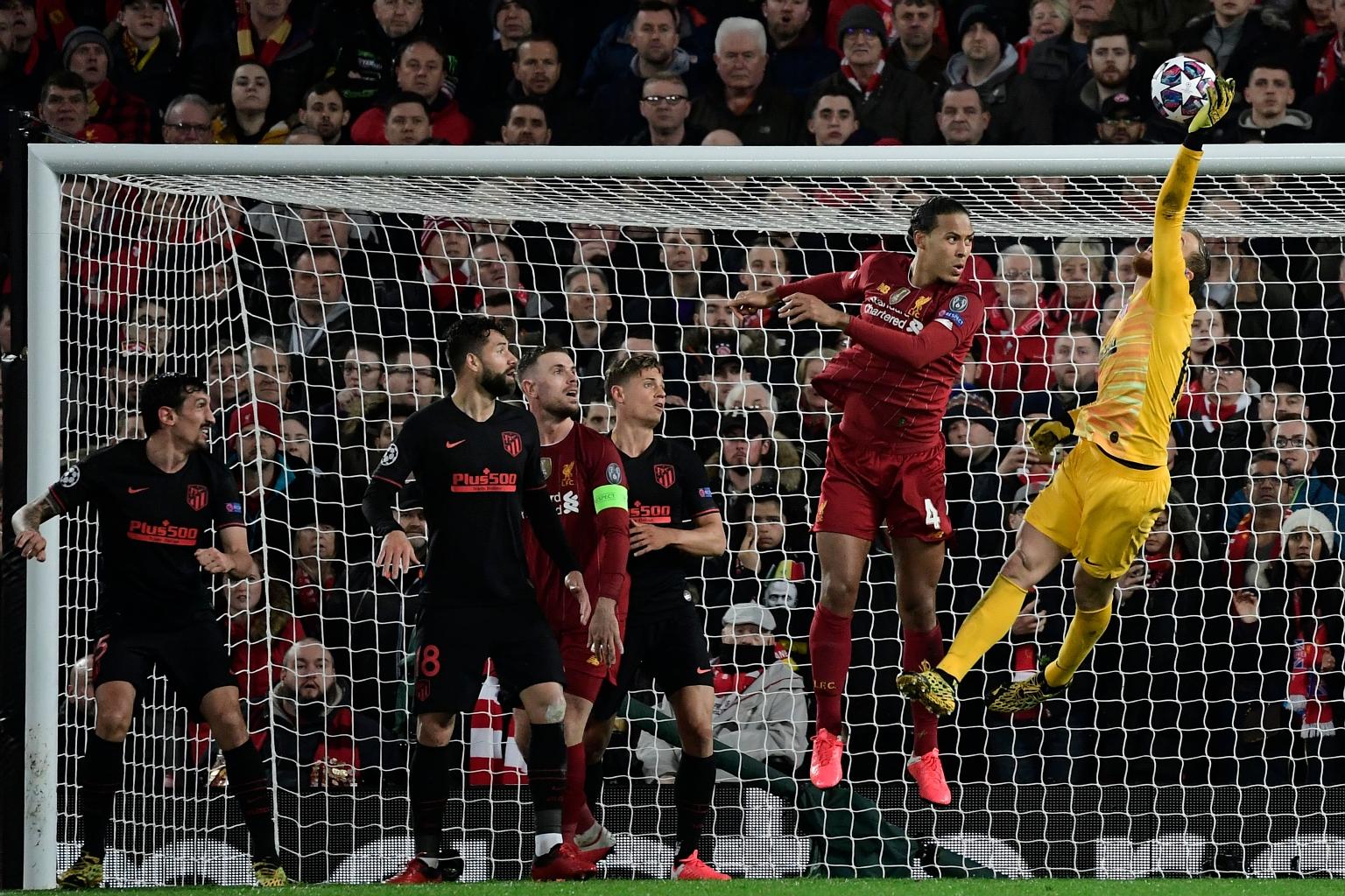 Atletico Madrid's goalkeeper Jan Oblak getting his hand on the ball during the match with Liverpool at Anfield on Wednesday. PHOTO: AGENCE FRANCE-PRESSE
