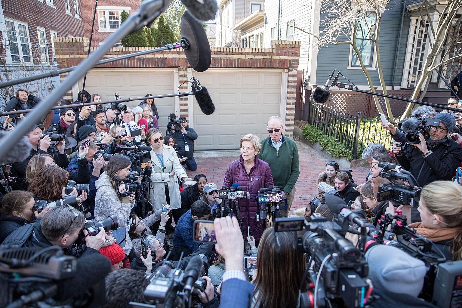 Ms Elizabeth Warren, with husband Bruce Mann, announcing her withdrawal from the race for the Democratic Party's presidential nomination last Thursday in Cambridge, Massachusetts. PHOTO: AGENCE FRANCE-PRESSE