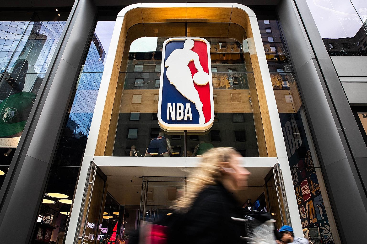 A National Basketball Association store on Fifth Avenue in New York City. The NBA was the first major North American sport to suspend its season after a player tested positive for the coronavirus. PHOTO: AGENCE FRANCE-PRESSE