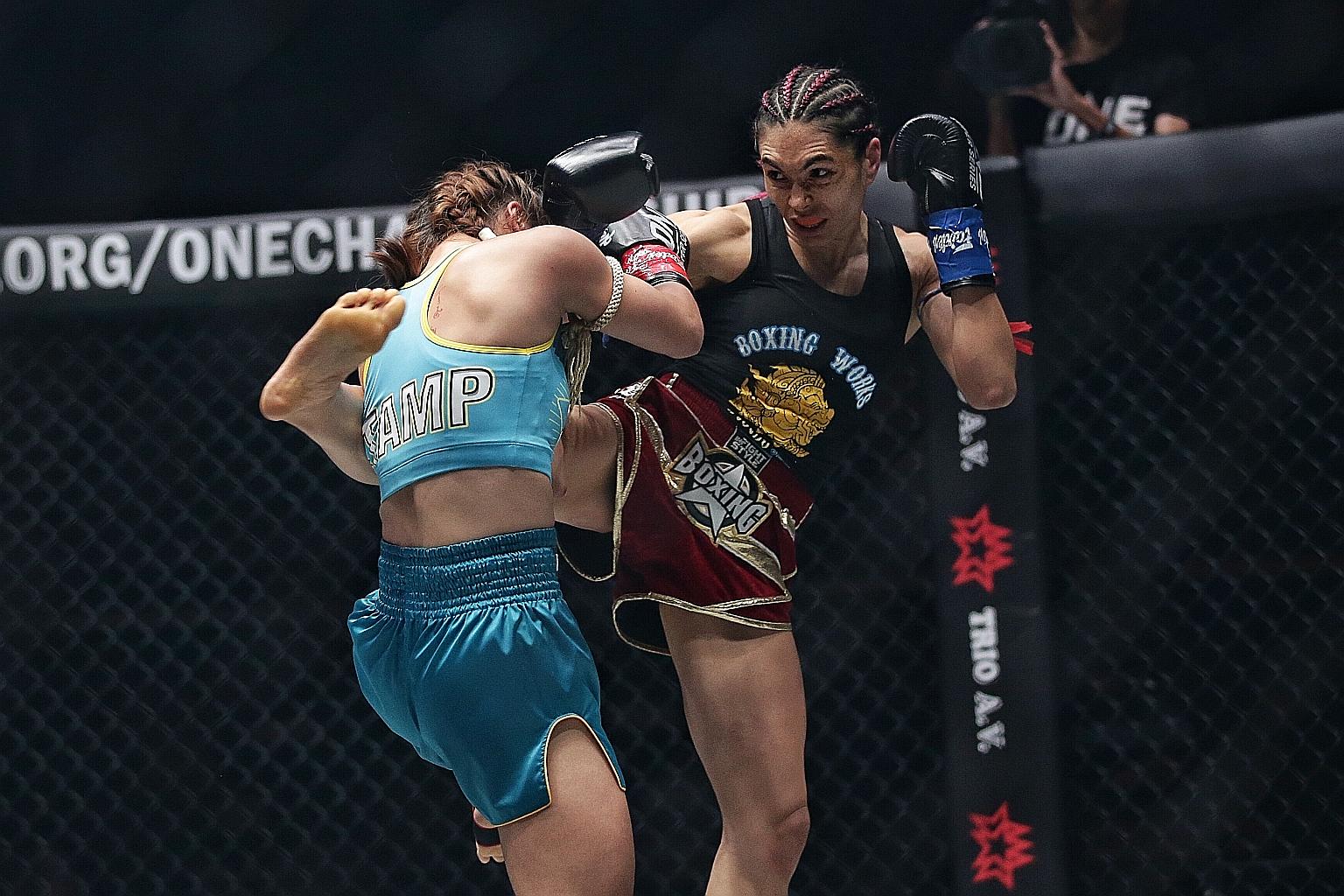 American fighter Janet Todd on her way to taking the atomweight kickboxing title away from Thailand's Stamp Fairtex in the King of the Jungle closed-door event at the Singapore Indoor Stadium on Feb 28. ST PHOTO: KEVIN LIM
