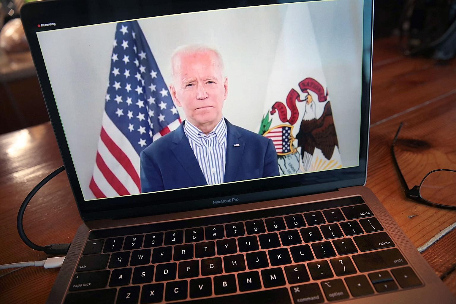 Former vice-president Joe Biden speaking to supporters by video on Friday night in what his campaign called a "virtual town hall with Illinois", instead of an originally scheduled event in Chicago. PHOTO: AGENCE FRANCE-PRESSE