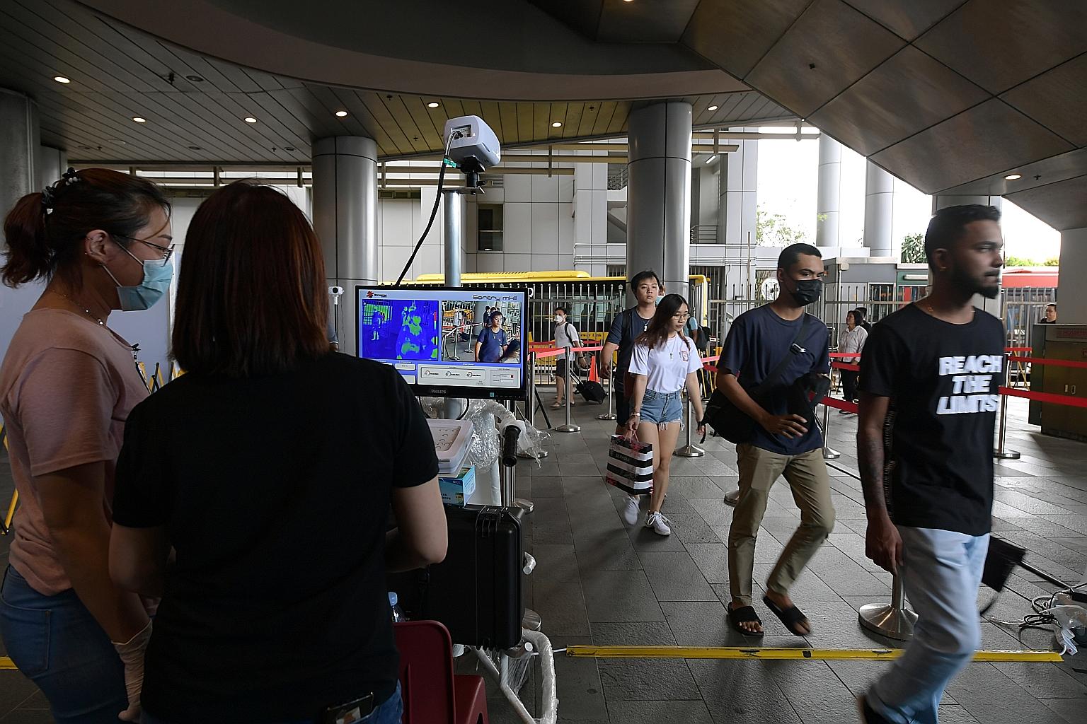 Singaporeans and Malaysians who use the Woodlands Checkpoint (right) and other sea and land crossings between the two countries will not be subject to the stricter border curbs kicking in today. ST PHOTO: NG SOR LUAN