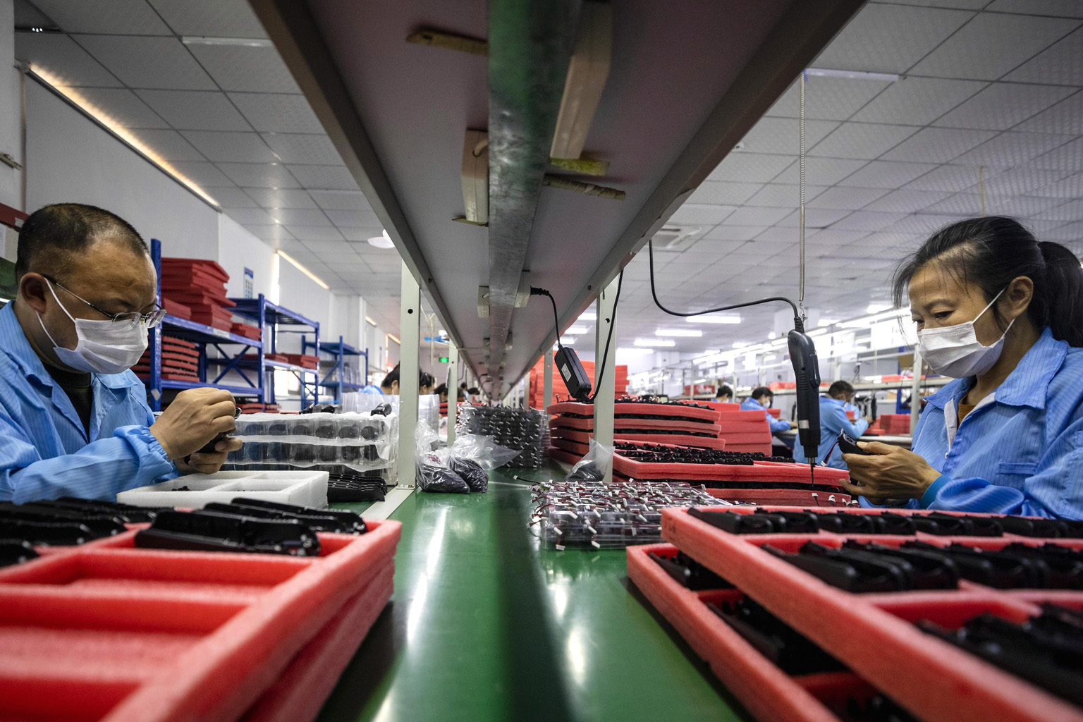 Workers at a Hohem Technology factory in Shenzhen, in China's Guangdong province. China's industrial output is forecast to have shrunk 3 per cent from a year earlier in the first two months of this year.