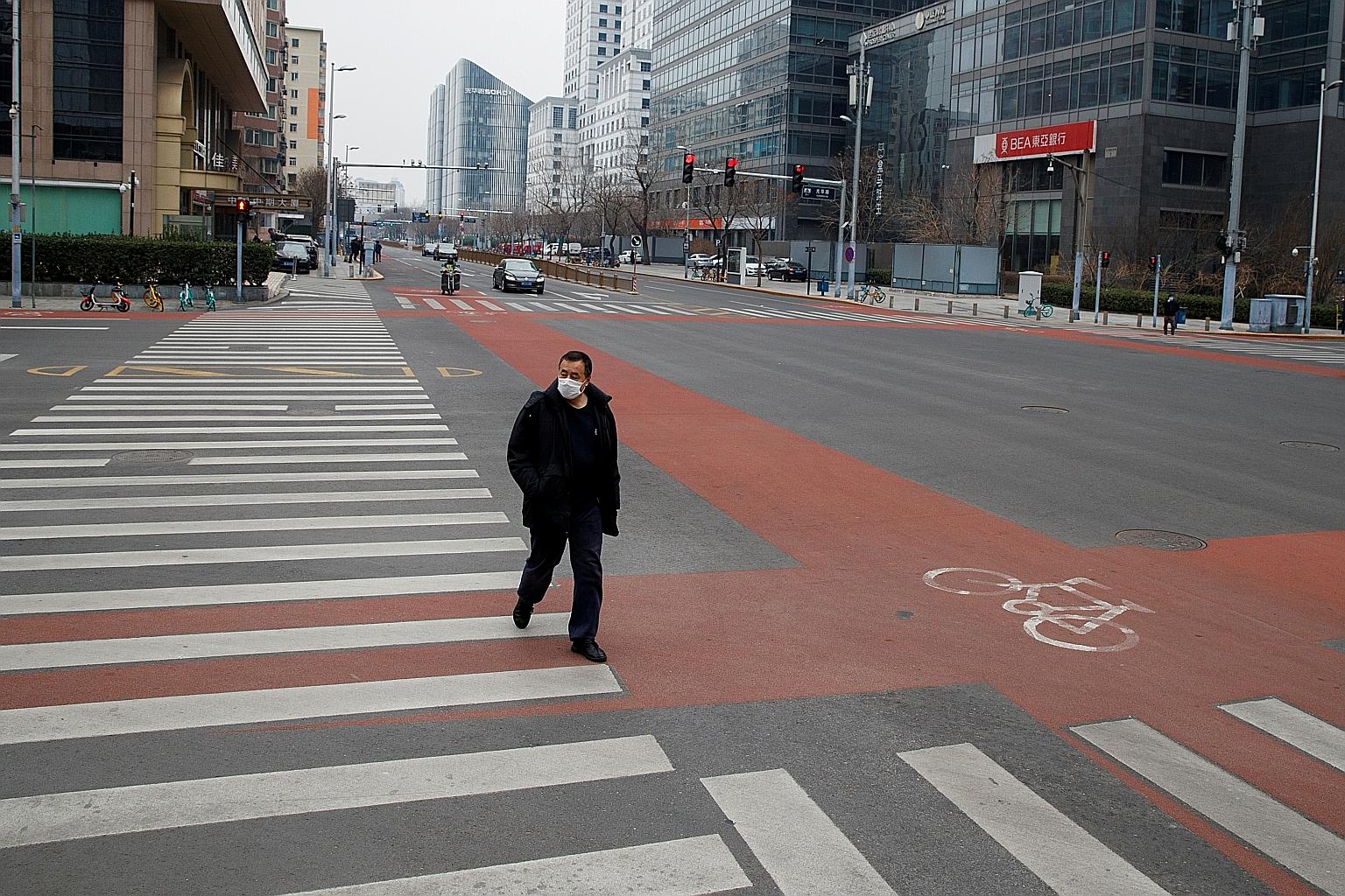 A fairly empty street in Beijing's central business district last month. The coronavirus outbreak in Wuhan dramatically worsened in January, prompting China to lock down Hubei province, extend holidays and restrict travel and business across the coun