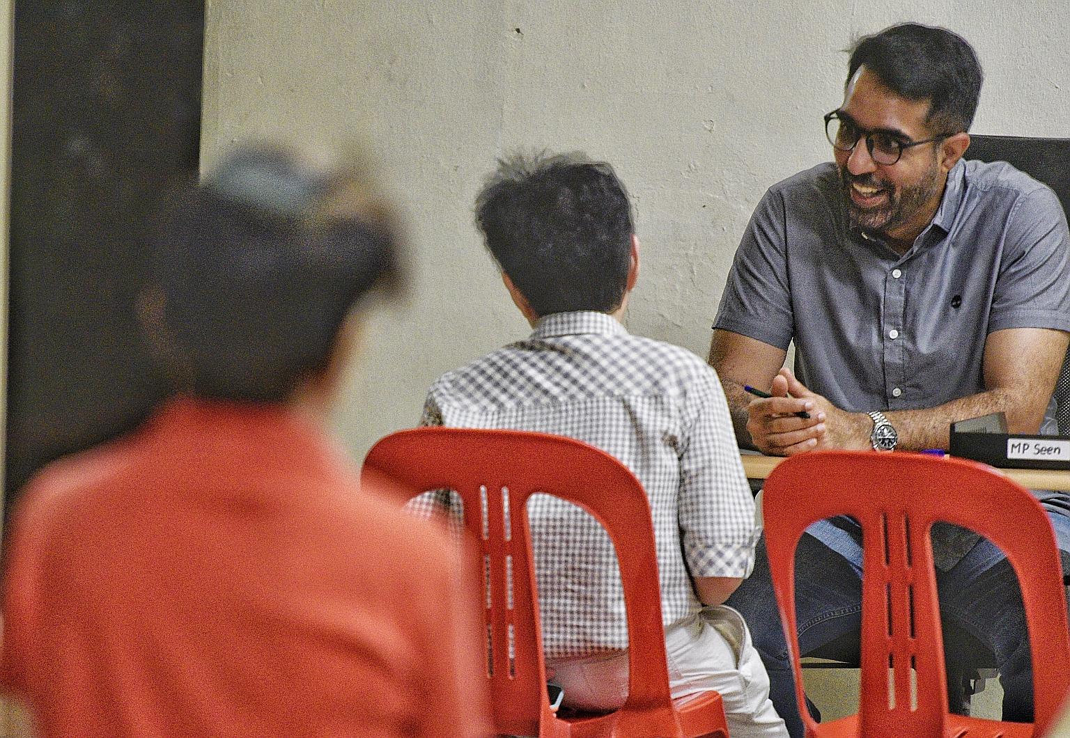 Workers' Party chief Pritam Singh, an MP for Aljunied GRC, at his Meet-the-People Session in Bedok Reservoir Road yesterday. He said the party will continue with house visits, but has limited the number of people at such visits and during other activ
