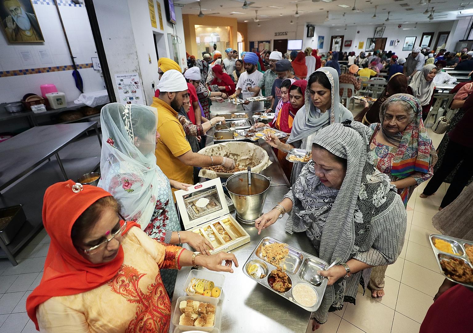Food catering for visitors and devotees in a sacred religious practice known as langar (left) will be suspended at the Silat Road Sikh Temple and the Central Sikh Temple over the next four weeks, although an exception will be made for weddings. ST PH