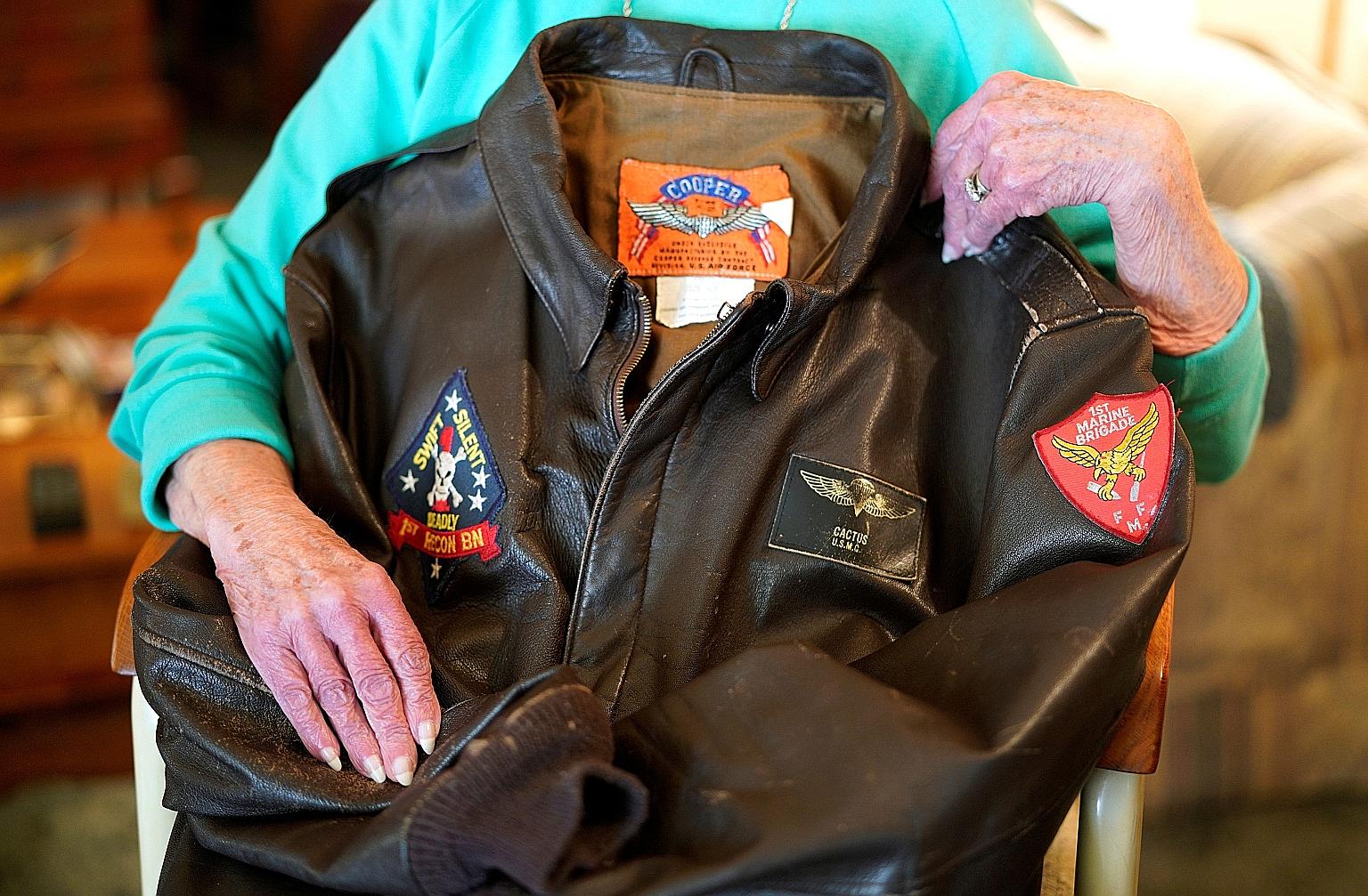 Ms Shirley Hollenback, wife of Mr Gerald Hollenback - whose ashes were lost by Sunset Mesa Funeral Directors - posing with his Marine Corps bomber jacket in her home in Montrose, Colorado, in December 2017. PHOTO: REUTERS