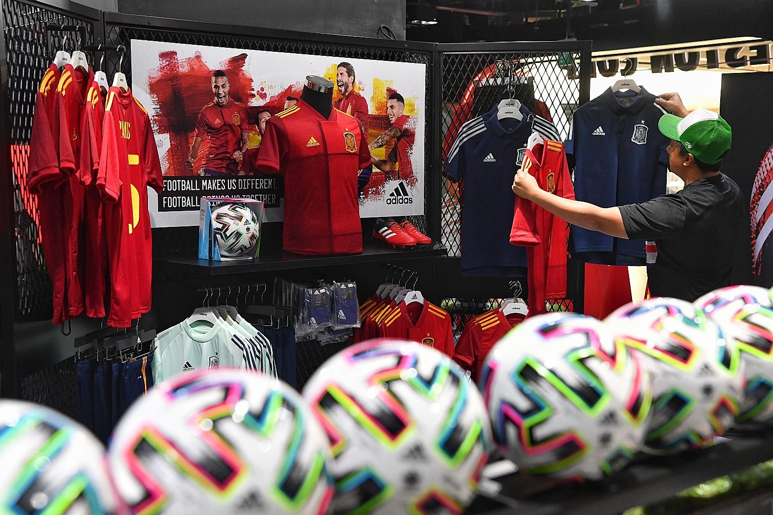 Football jerseys for Euro 2020 being displayed at the Weston store at Kallang Wave Mall yesterday. The European Championship has been postponed to next year. ST PHOTO: CHONG JUN LIANG