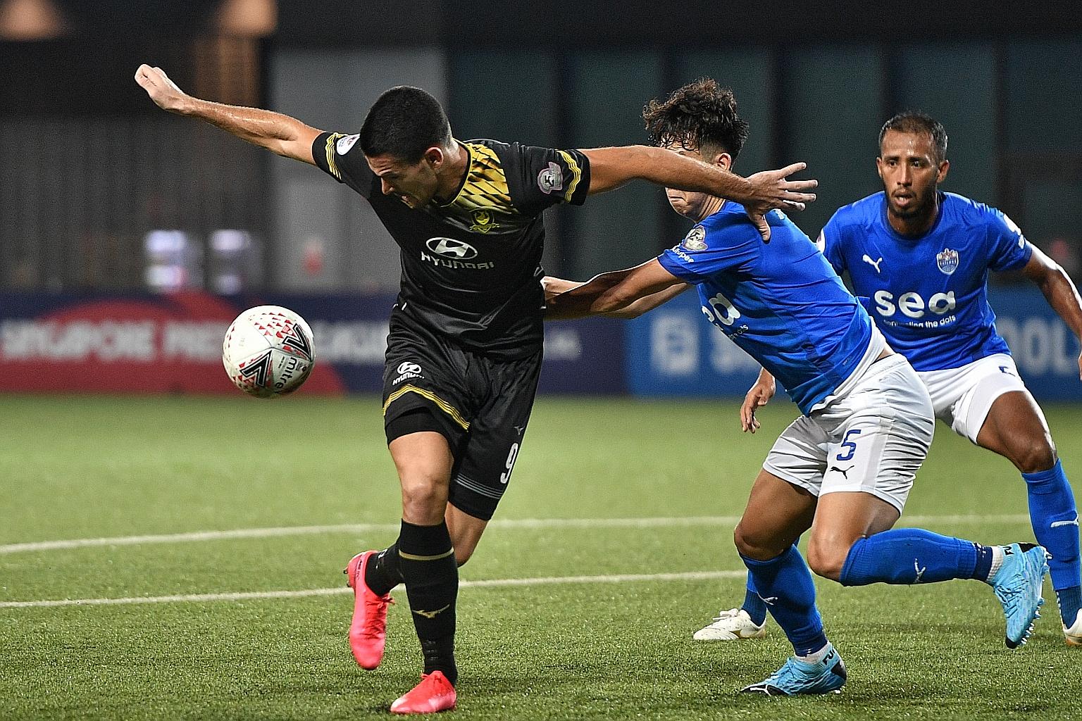 Tampines Rovers' Boris Kopitovic shielding the ball against Lion City Sailors players. He got the breakthrough on the hour mark to spark the 4-0 rout at Our Tampines Hub. ST PHOTO: ARIFFIN JAMAR