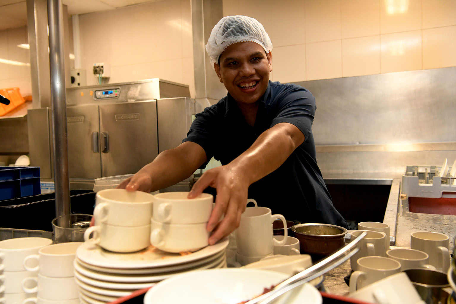 Mr Danial Affandy, 20, who is intellectually disabled, has been working at the Pan Pacific Singapore since 2018 and enjoys his job operating and maintaining cleaning equipment.