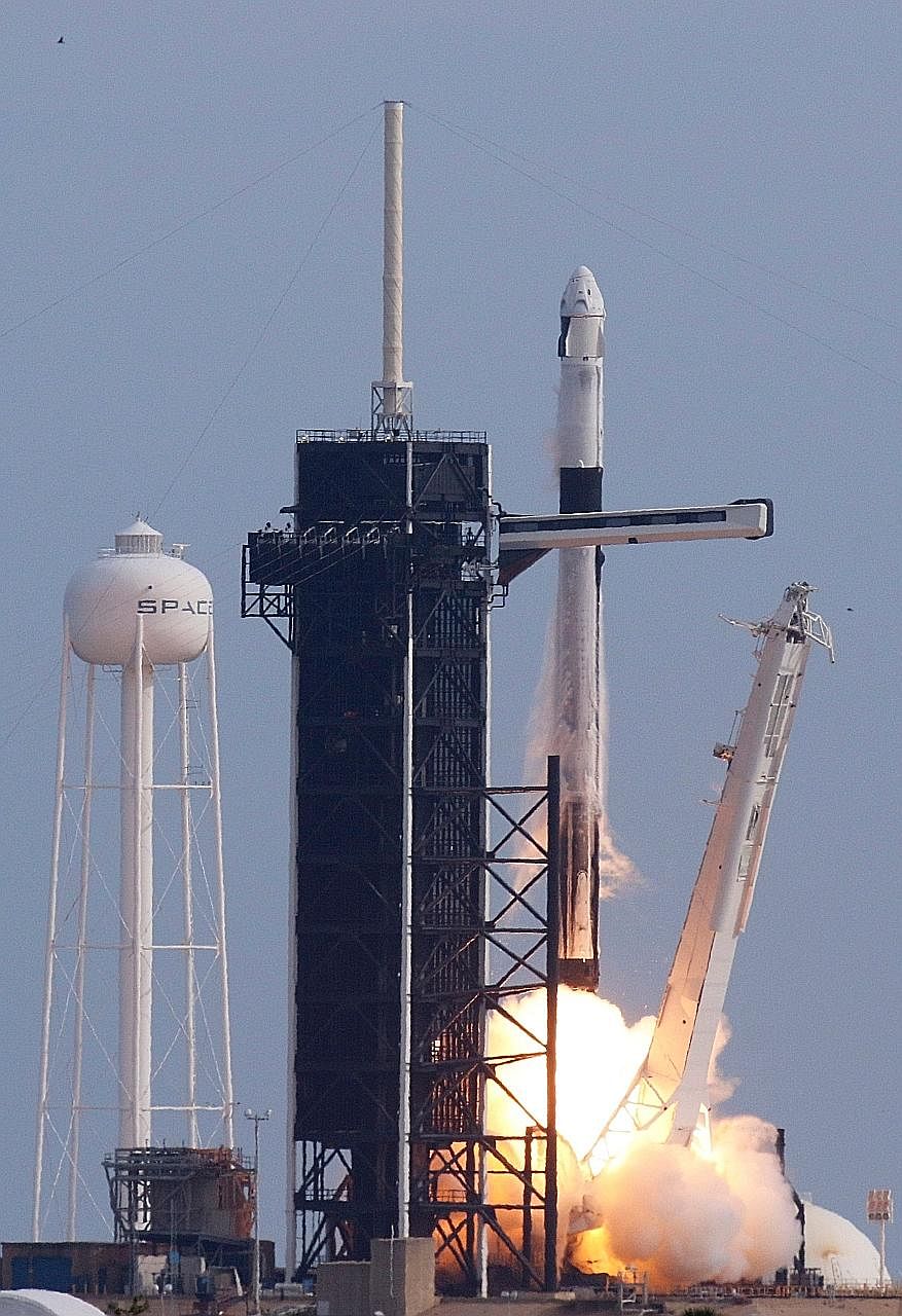 A SpaceX Falcon 9 rocket, carrying the Crew Dragon astronaut capsule, in a test lift-off in January at the Kennedy Space Centre in Florida.