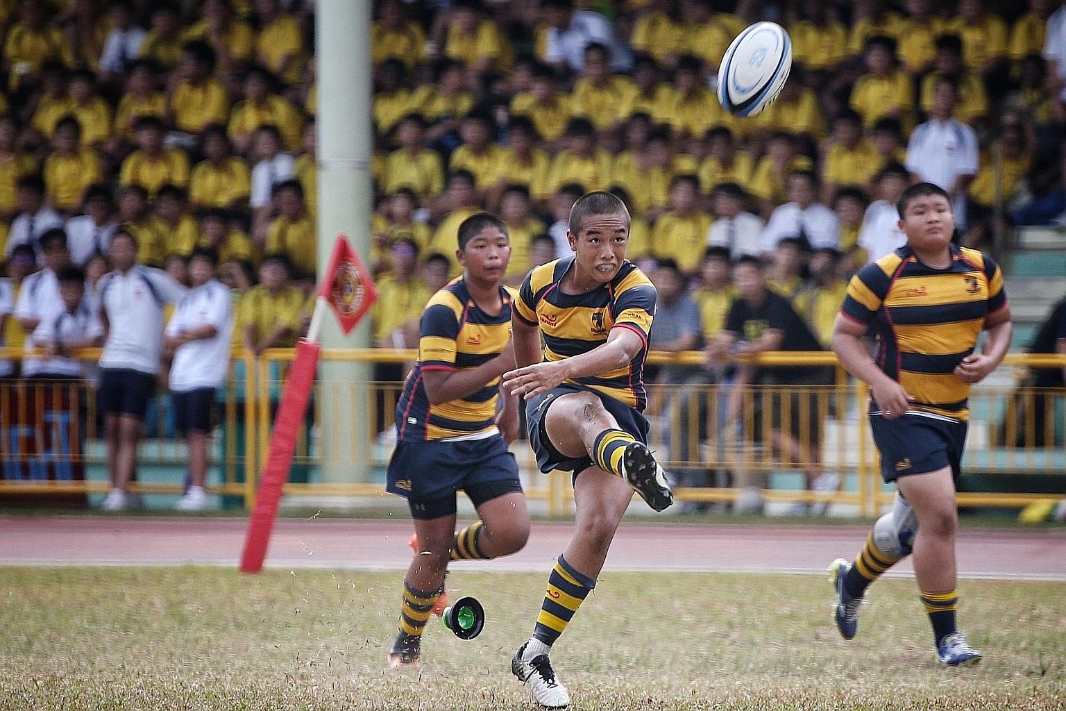 Anglo-Chinese School (Independent) player Tycen Yeoh kicking the ball during the C Division rugby final against St Andrew's last year. This year's National School Games have been suspended till after the June school holidays. ST FILE PHOTO